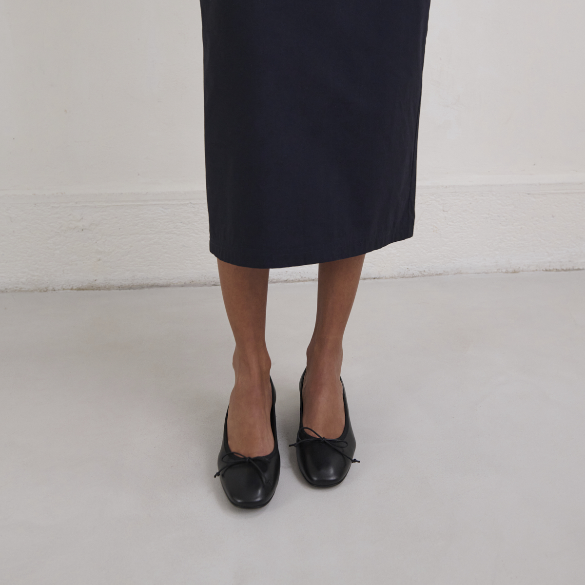 Heeled ballet flats in black leather | DADOU