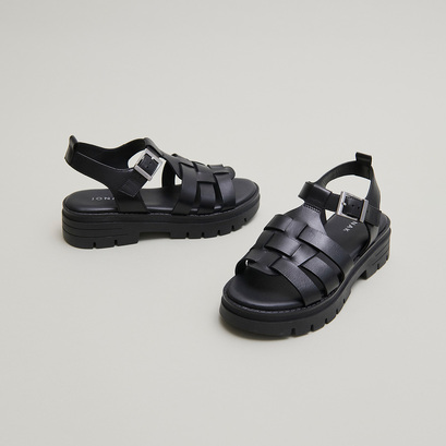 Sandals with notched soles in black leather | anastasia