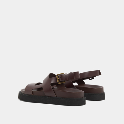 Cross-strap sandals in dark brown glazed leather | lagune