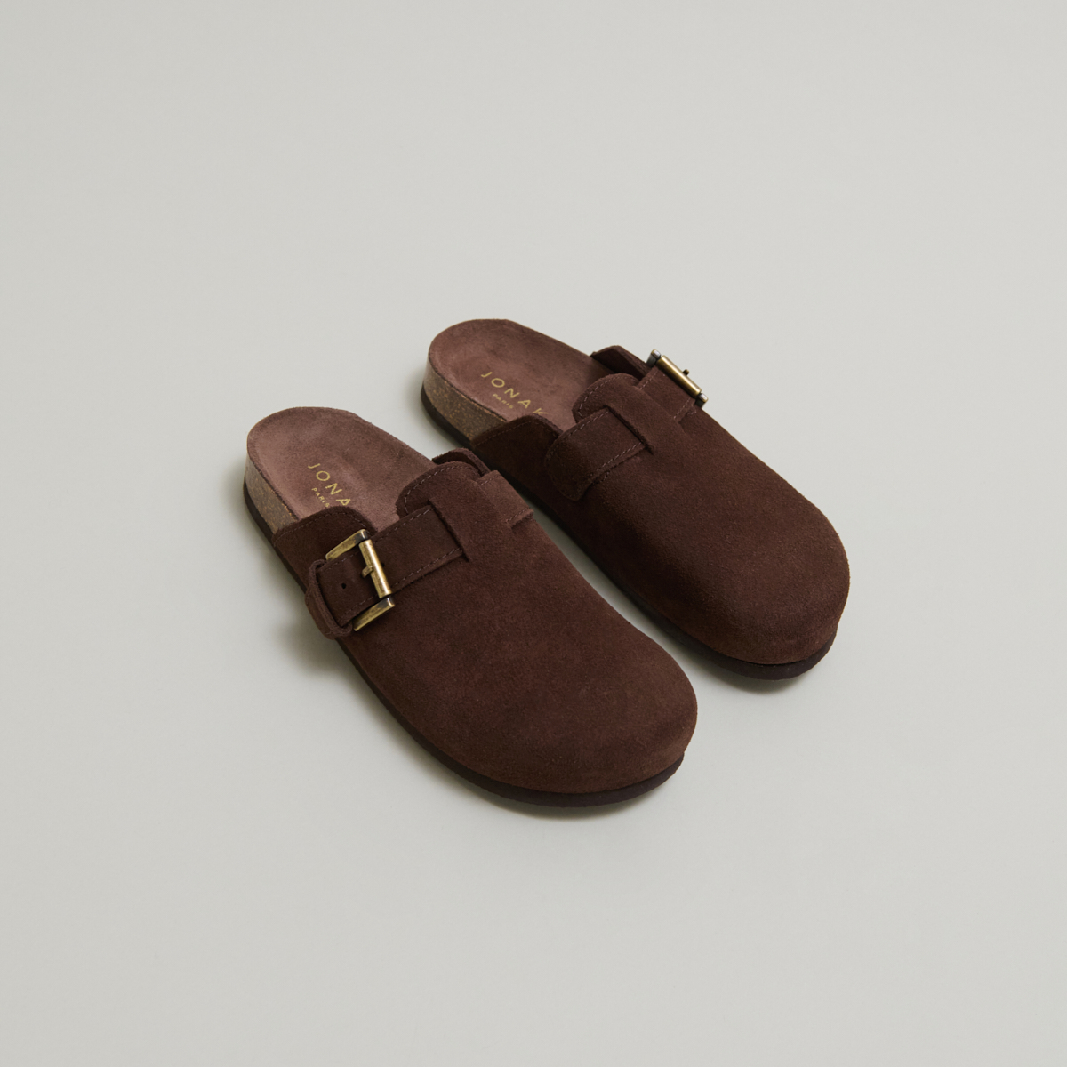 Mules with buckles in brown crust | MUNCH