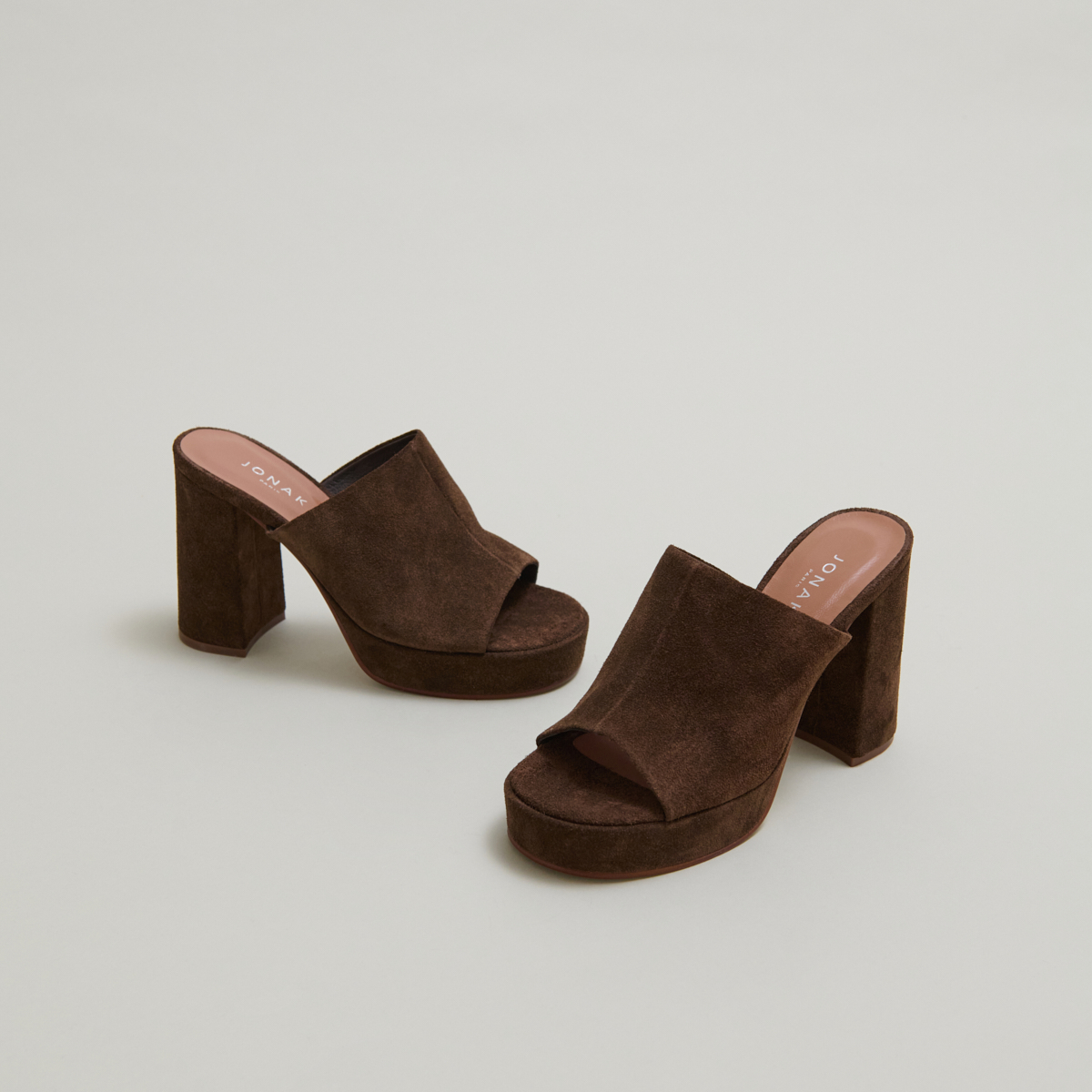 Heeled mules with platforms in brown suede | DELLE