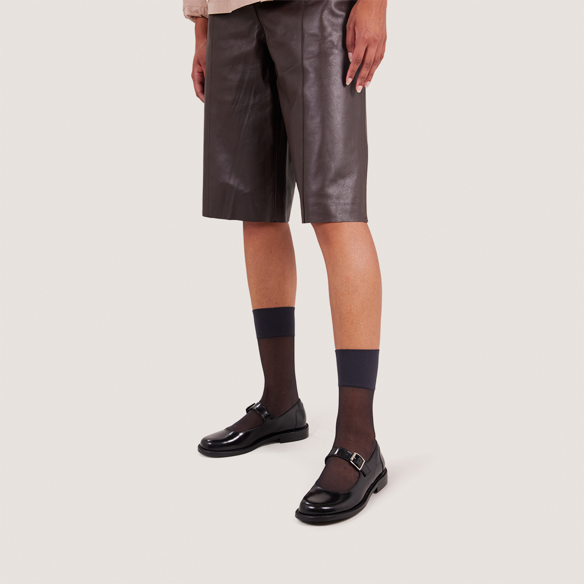 Ballet flats with straps and adjustable buckles in black glazed leather | DEMILIE