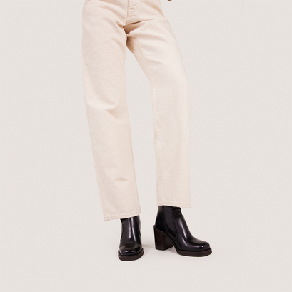 High-heel platform booties in aged black leather | benicio