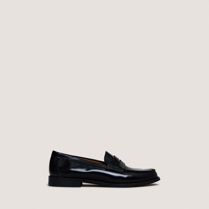 Penny loafers with raised soles in black glazed leather | audelya