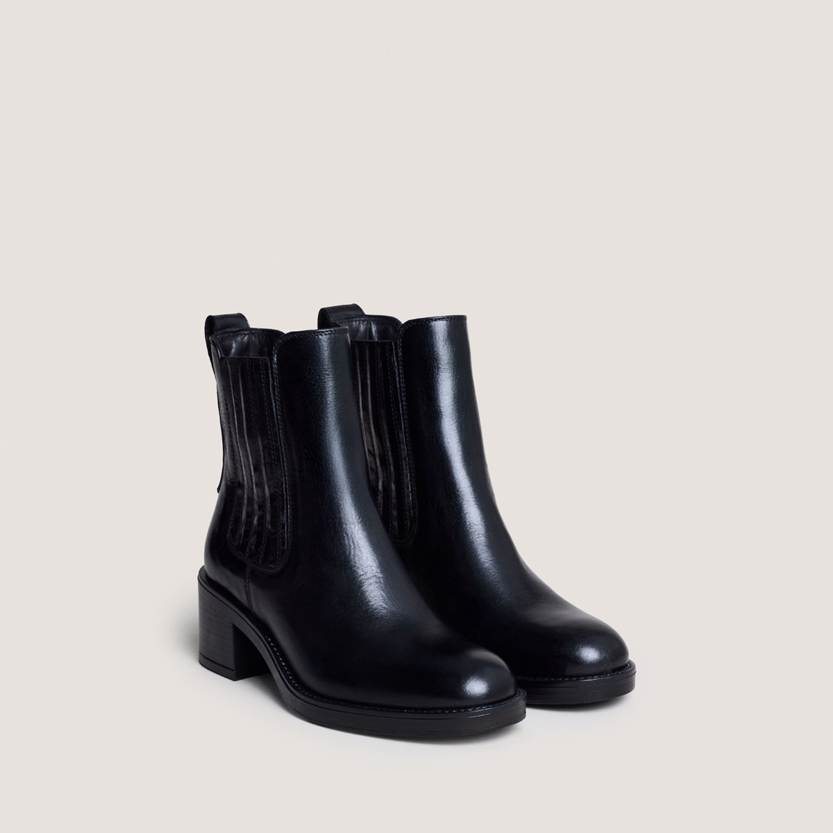 Heeled Boots in black leather | COLETTE