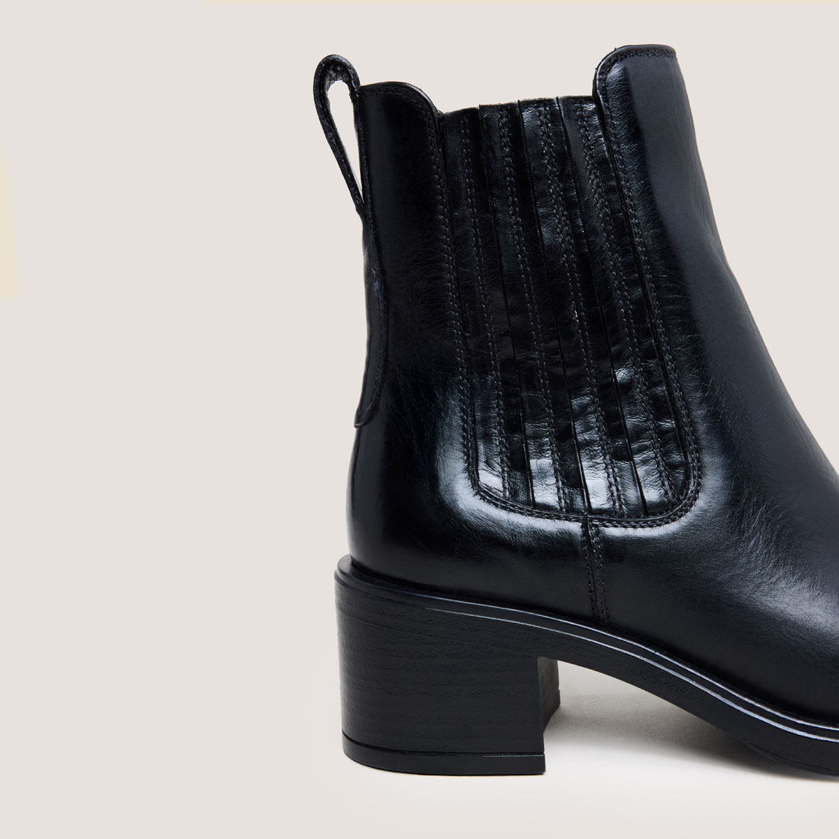Heeled Boots in black leather | COLETTE