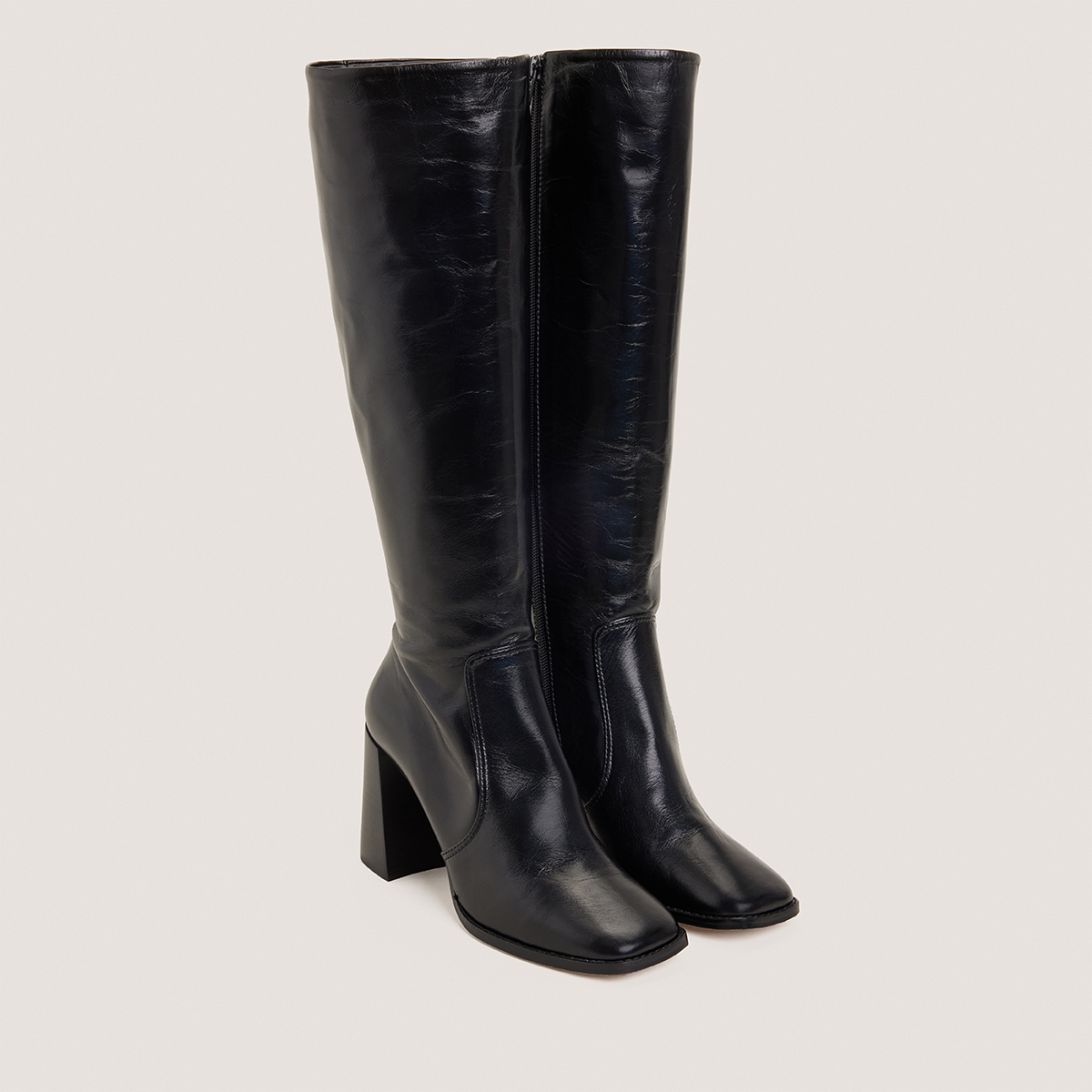 High-heeled boots in aged black leather | VAUBY