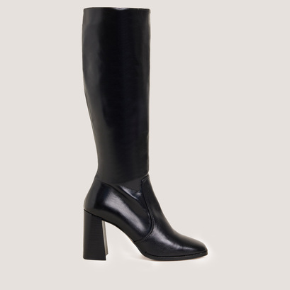 High-heeled boots in aged black leather | vauby