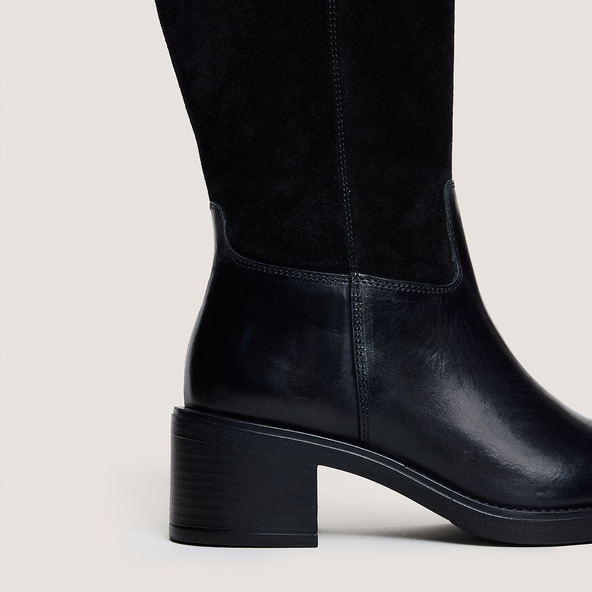 Heeled boots in black leather and suede | CLAIRE