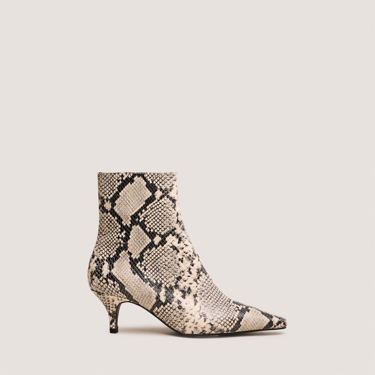 Pointed-toe stiletto-heel ankle boots in black and white reptile leather | BORG