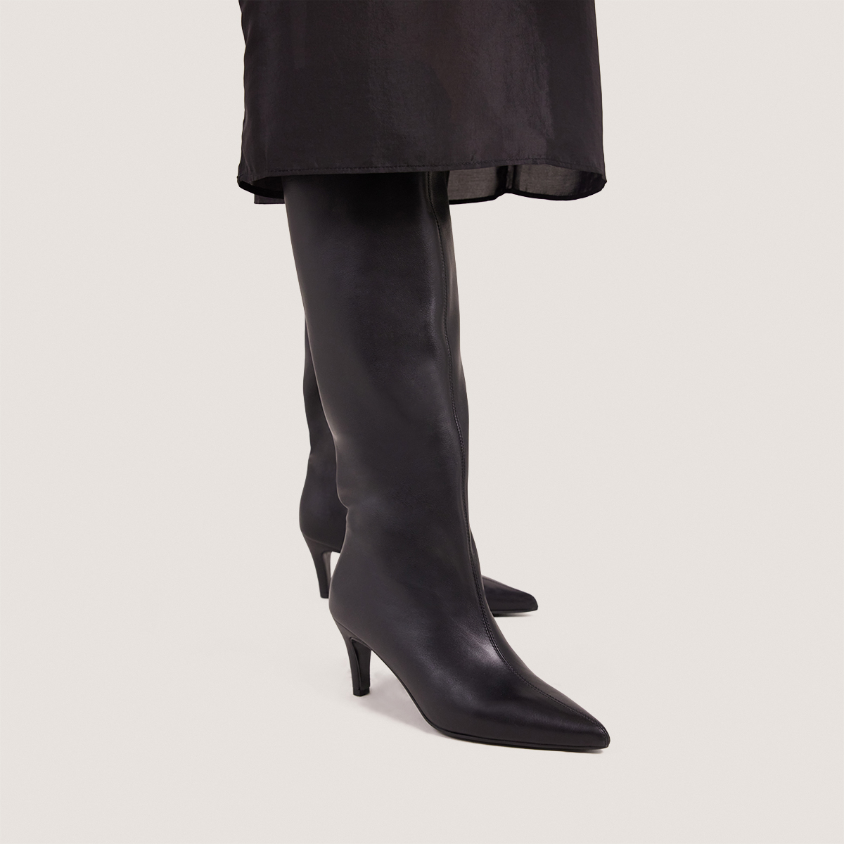 Heeled Pointed-Toe Boots in soft black leather | DELAINE