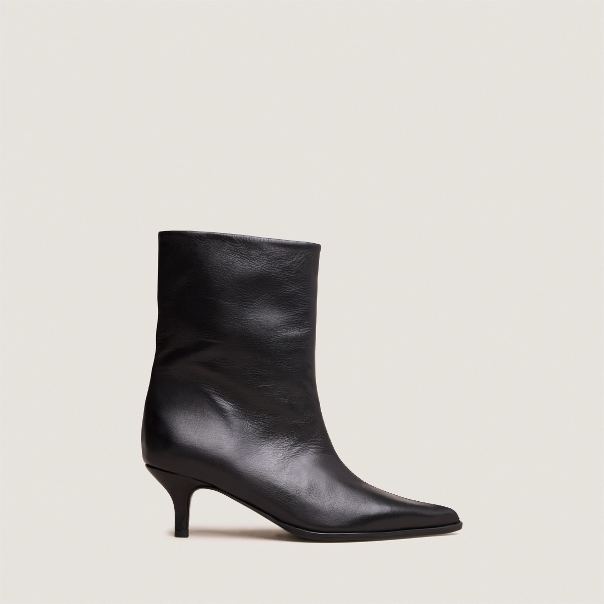 Low Thin-Heeled Pointed-Toe Ankle Boots in soft black leather | DELANIE