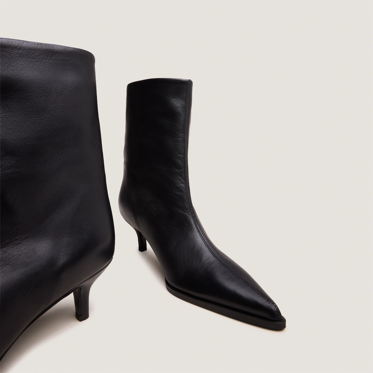 Low Thin-Heeled Pointed-Toe Ankle Boots in soft black leather | DELANIE