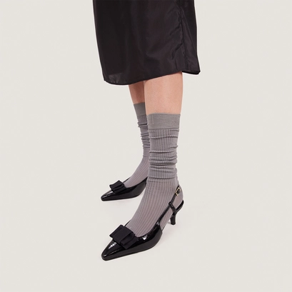 Bow pumps in pleated black patent leather | dalo