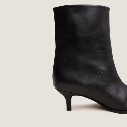 Low thin-heeled pointed-toe ankle boots in soft black leather | delanie