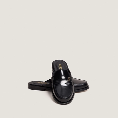 Backless loafers with monogram detailing in black patent leather | amaury