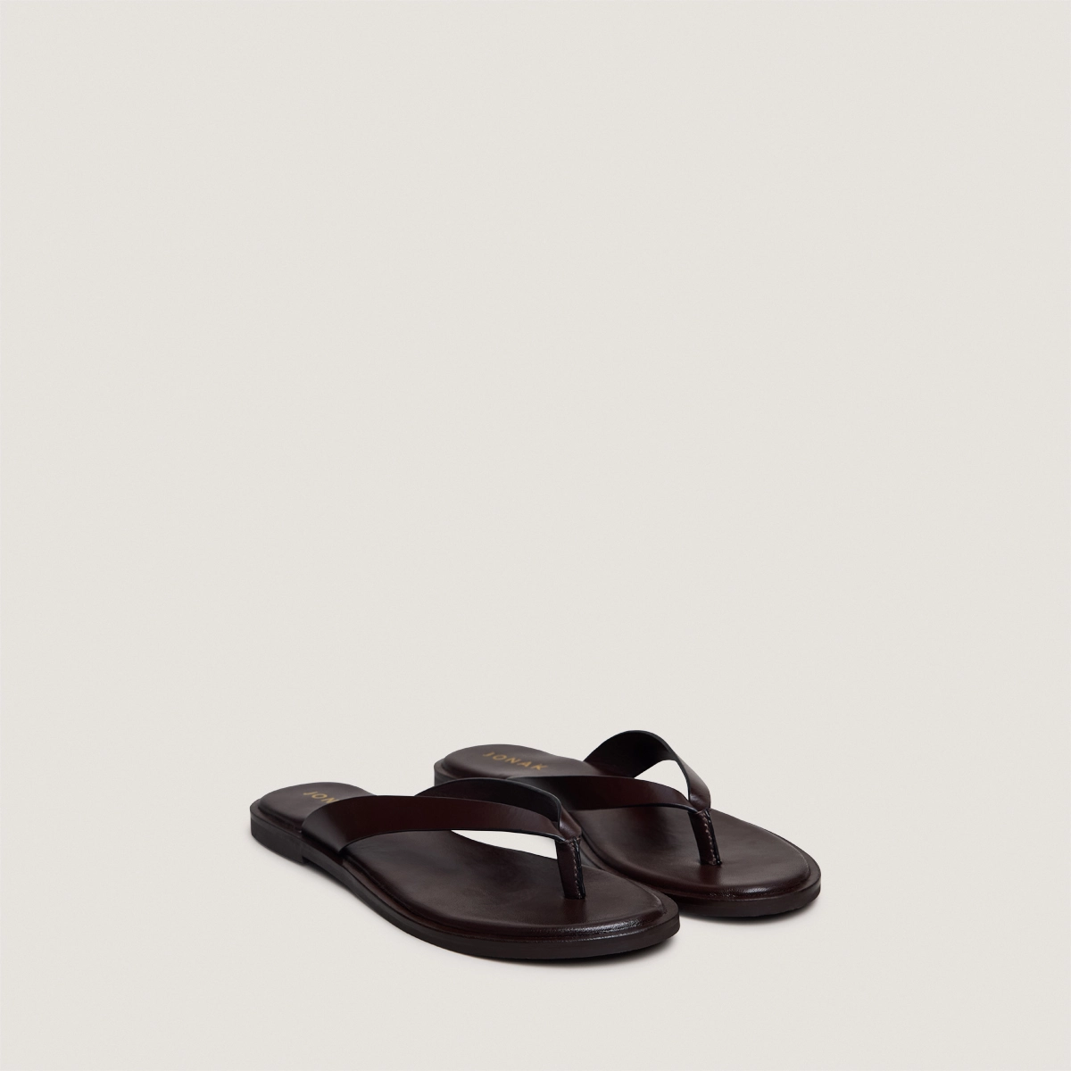 Thong sandals in dark brown leather | WITTY
