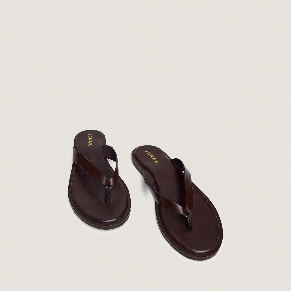 Thong sandals in dark brown leather | WITTY