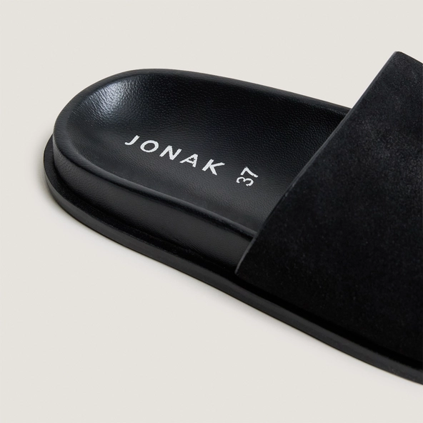 Flat mules in black split leather | WARNER