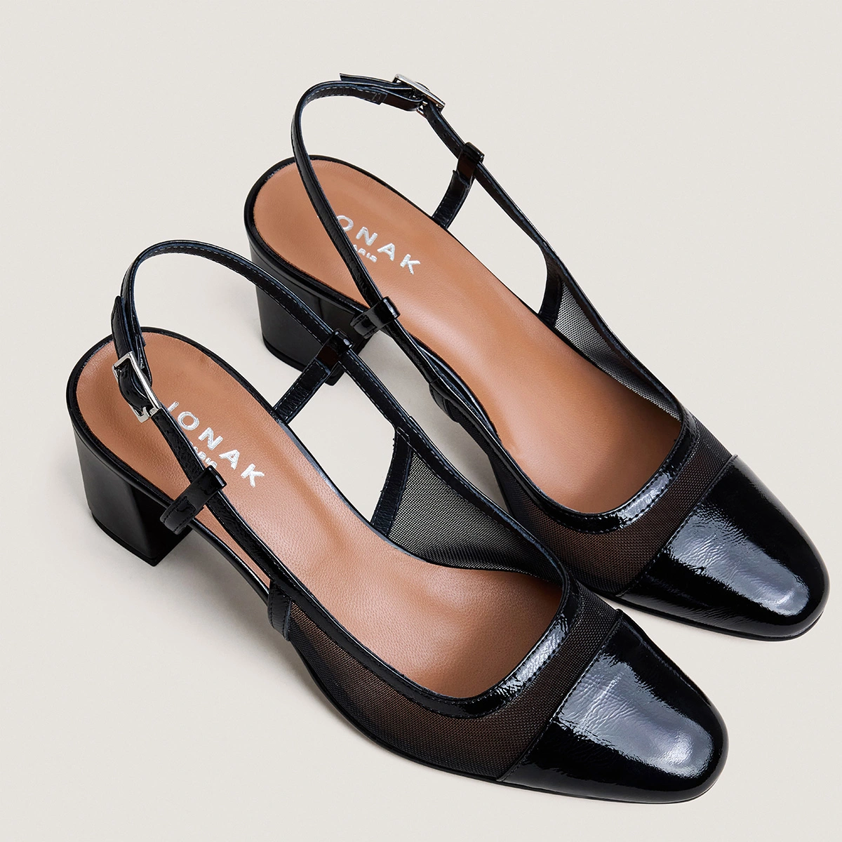 Heeled slingbacks in black pleated patent leather and black mesh | DRAG