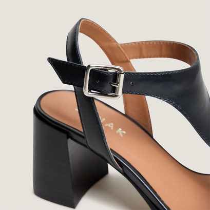 High laminated-heel sandals in black leather | vodka