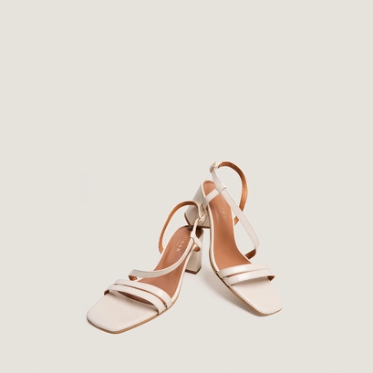 Heeled sandals with straps in ecru aged leather | vimy