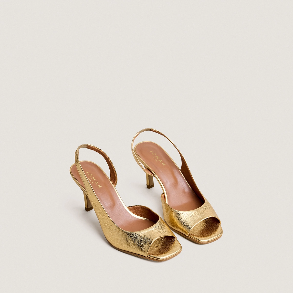 High-heel slingback pumps in gold crackled leather | DIRA