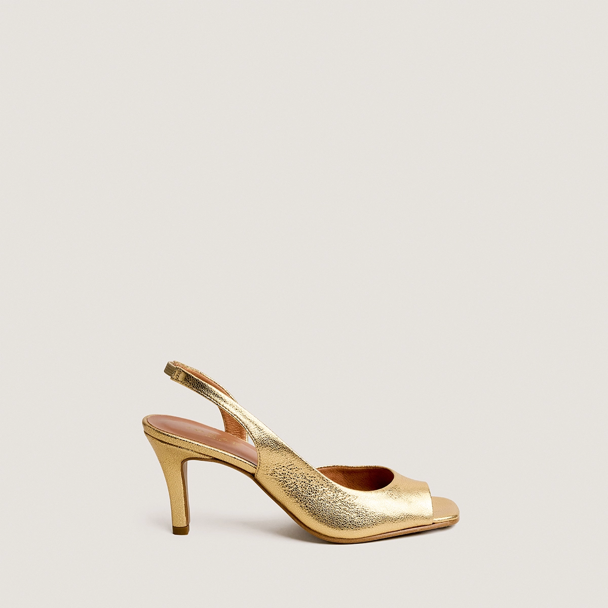 High-heel slingback pumps in gold crackled leather | DIRA