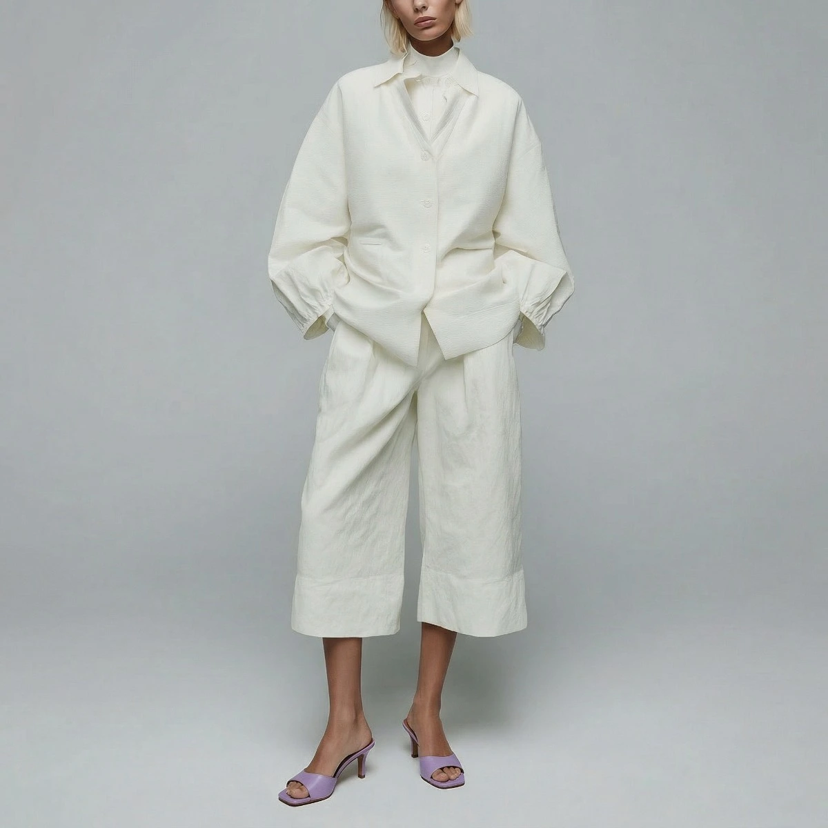 Heeled mules in lilac pleated patent leather | VERTIGO