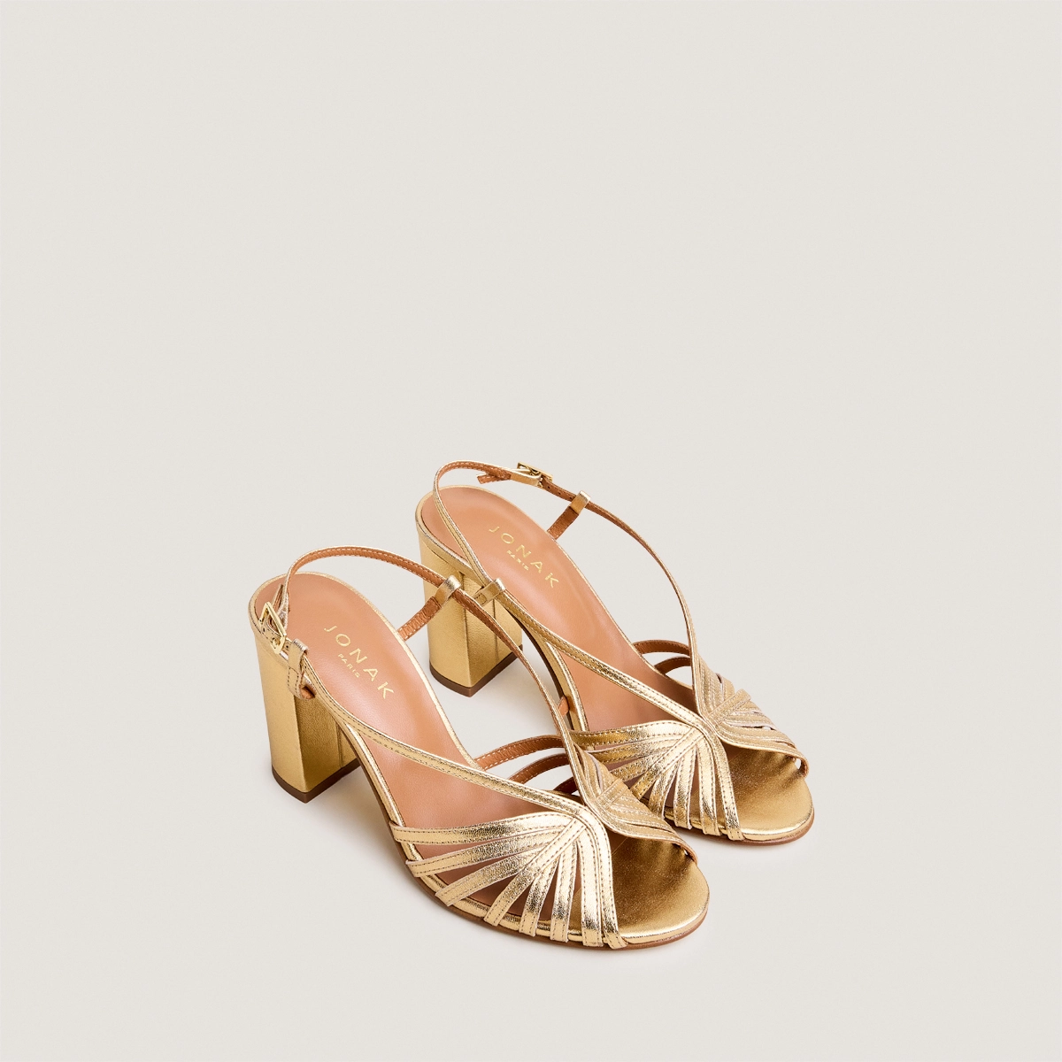 Round-toe heeled sandals in gold metallic leather | DECEMBRE
