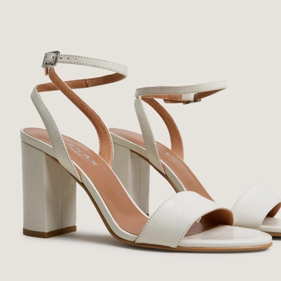 High-heel ankle-strap sandals in ecru aged leather | danger