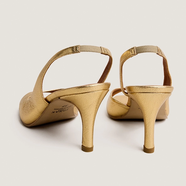 High-heel slingback pumps in gold crackled leather | DIRA