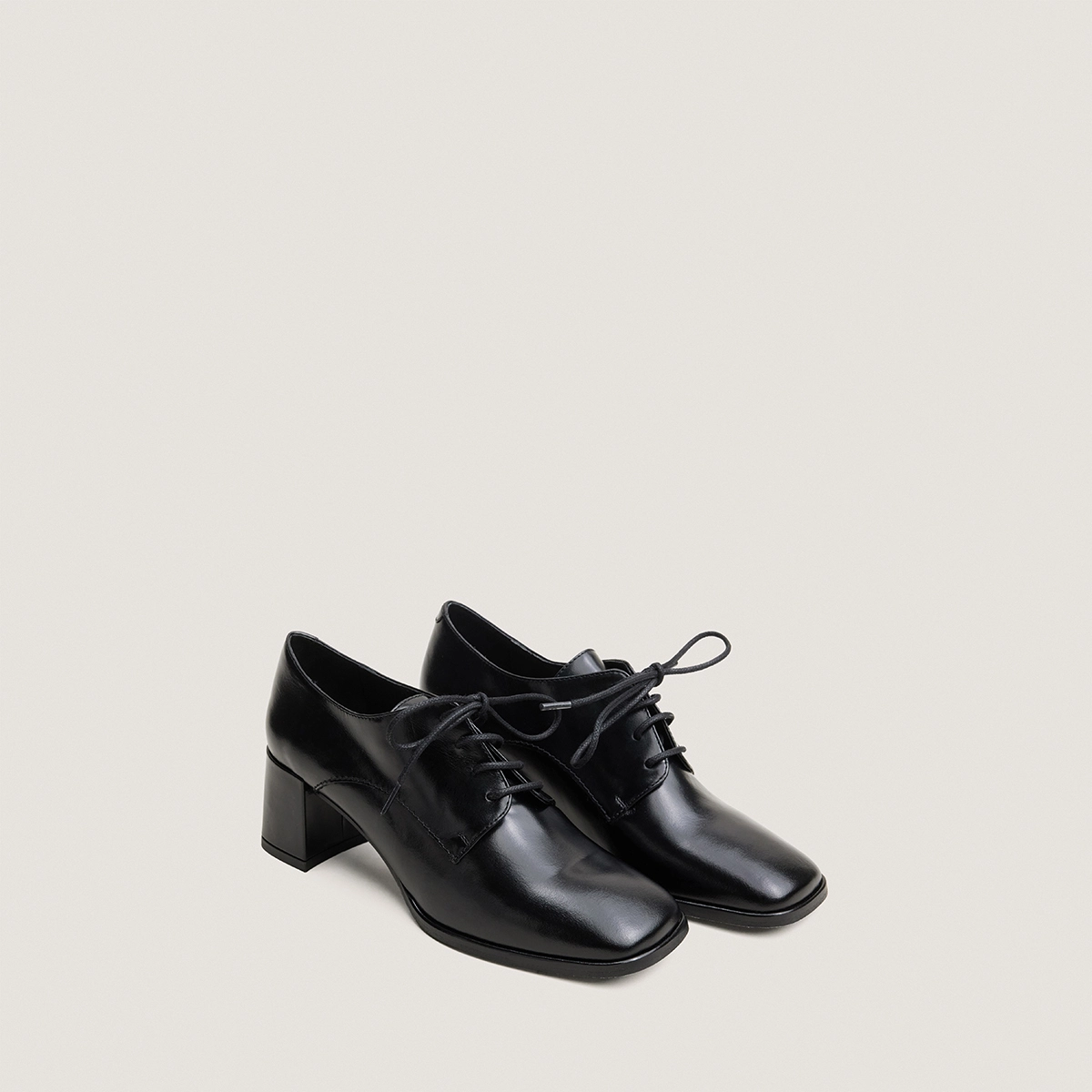Heeled lace-up loafers in black leather | VAXANA