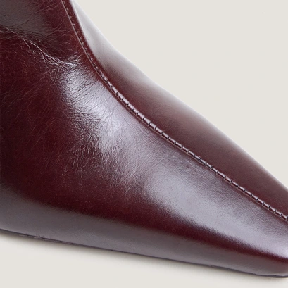 Heeled pointed toe ankle boots in chocolate aged leather | bronzo