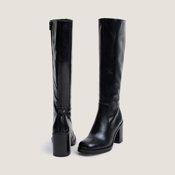 Boots with overflowing heels in black leather | BRETZEL