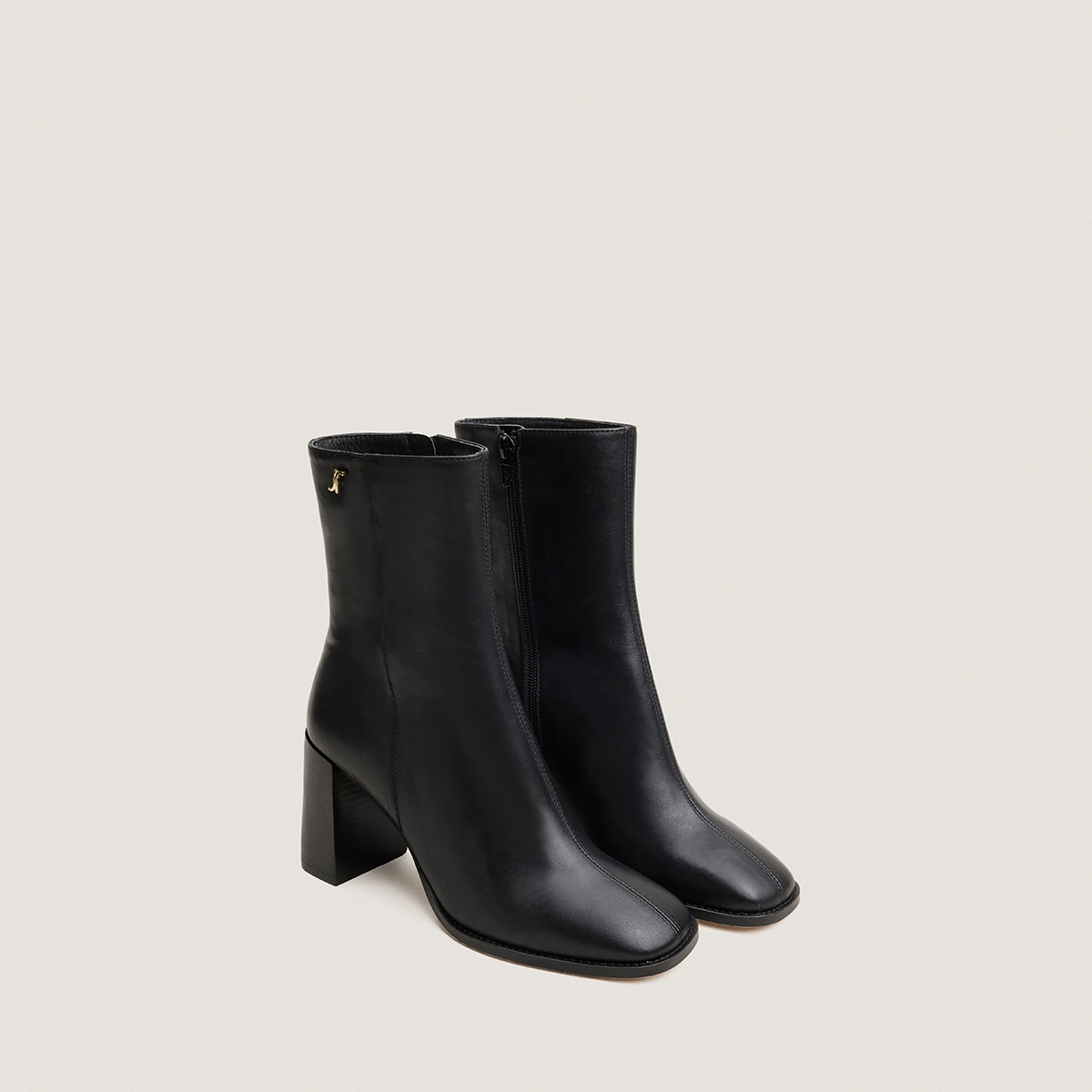 Heeled monogram ankle boots in black leather | VAUBAS