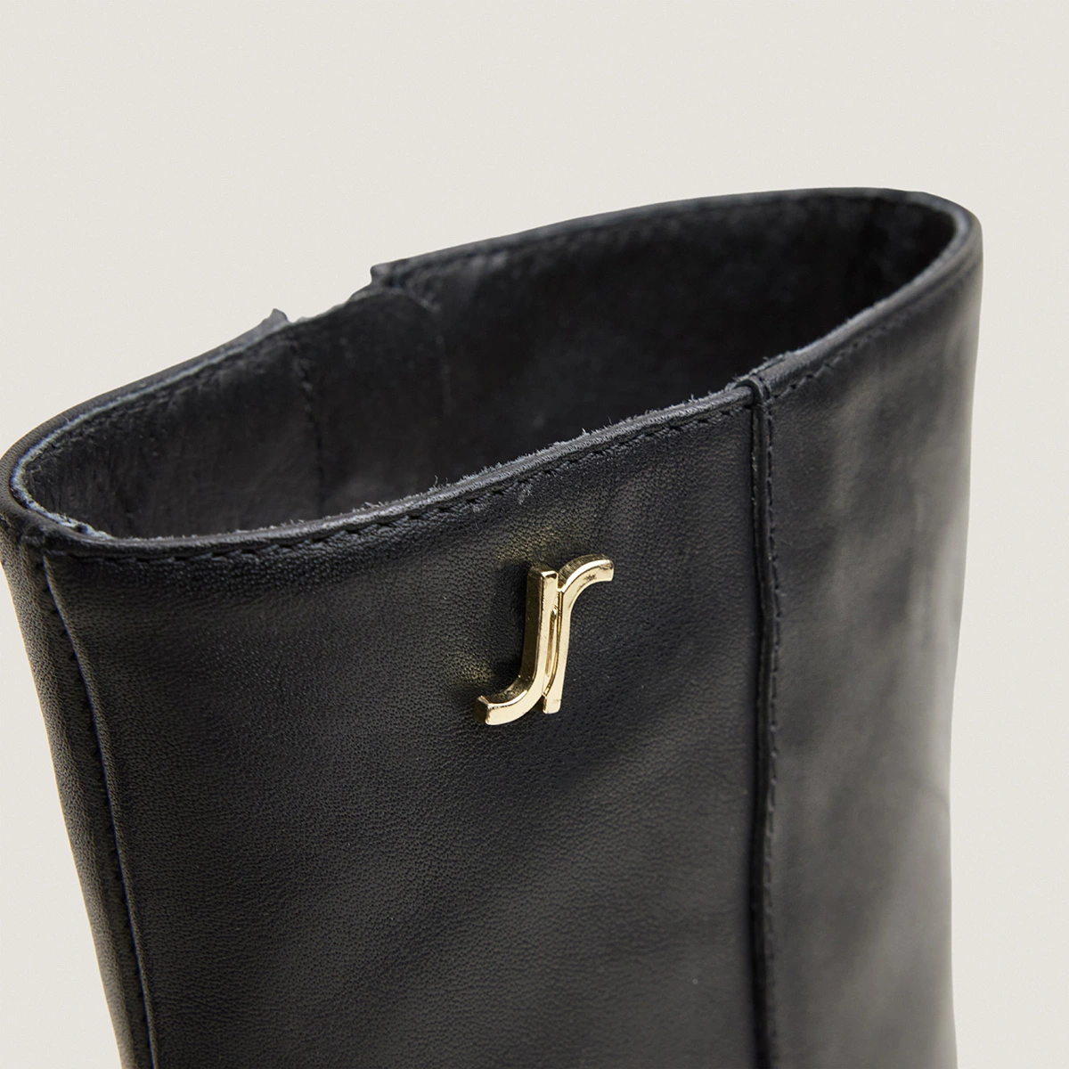 Heeled monogram ankle boots in black leather | VAUBAS