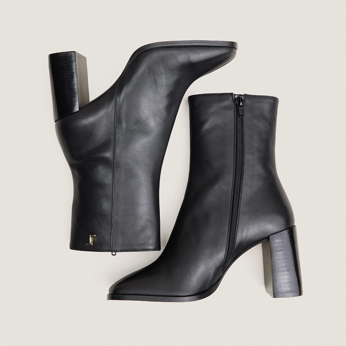 Heeled monogram ankle boots in black leather | VAUBAS