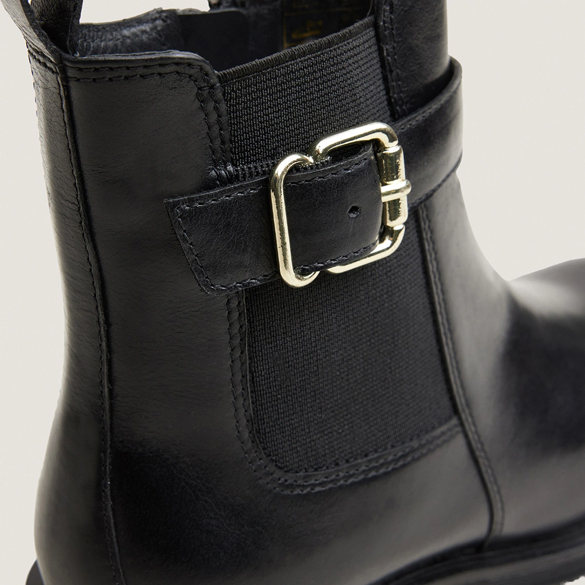 Low boots with buckles and lug soles in black leather | AGILE