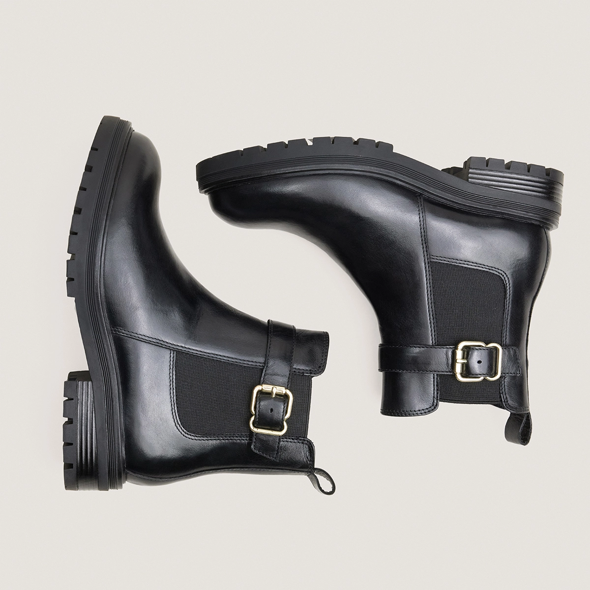 Low boots with buckles and lug soles in black leather | AGILE