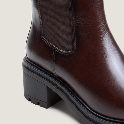 Ankle boots with lug soles red brown