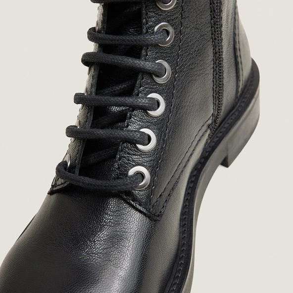 Heeled boots in black grained leather | APHELIE