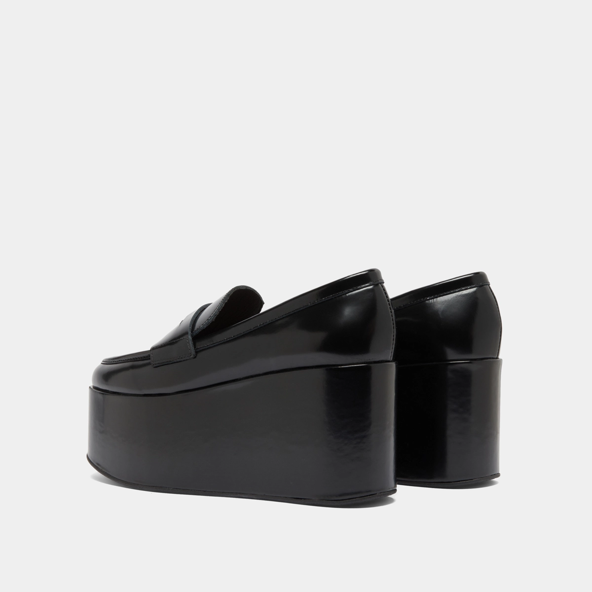 Mocassins à plateformes in black glazed leather | DOPO