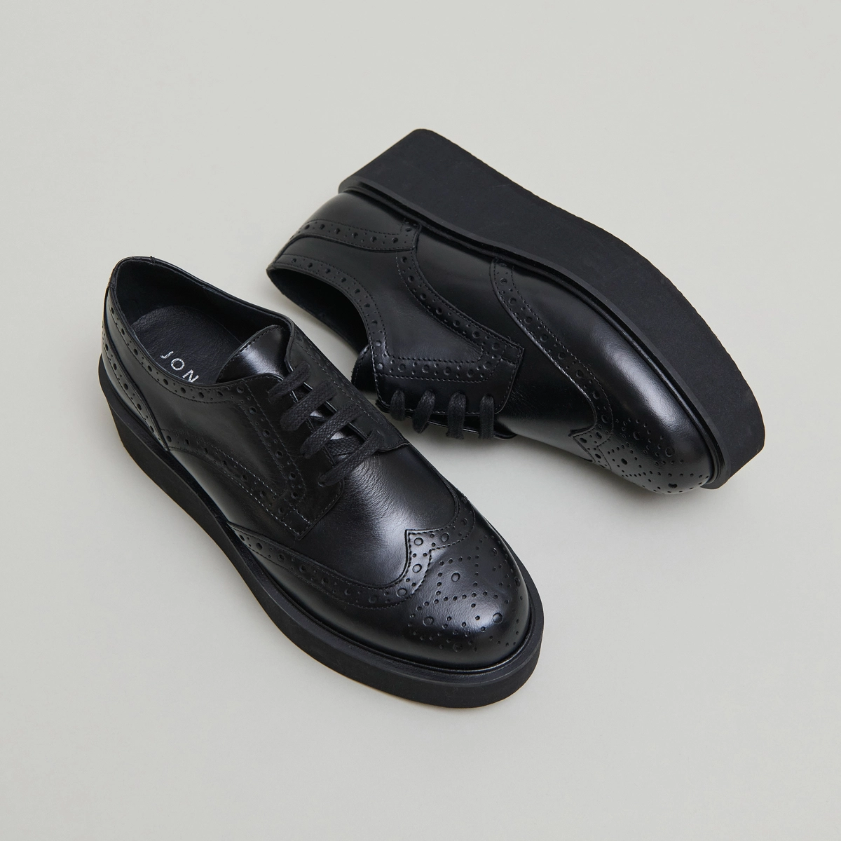 Derbies compensées in black leather | ADRIELLE
