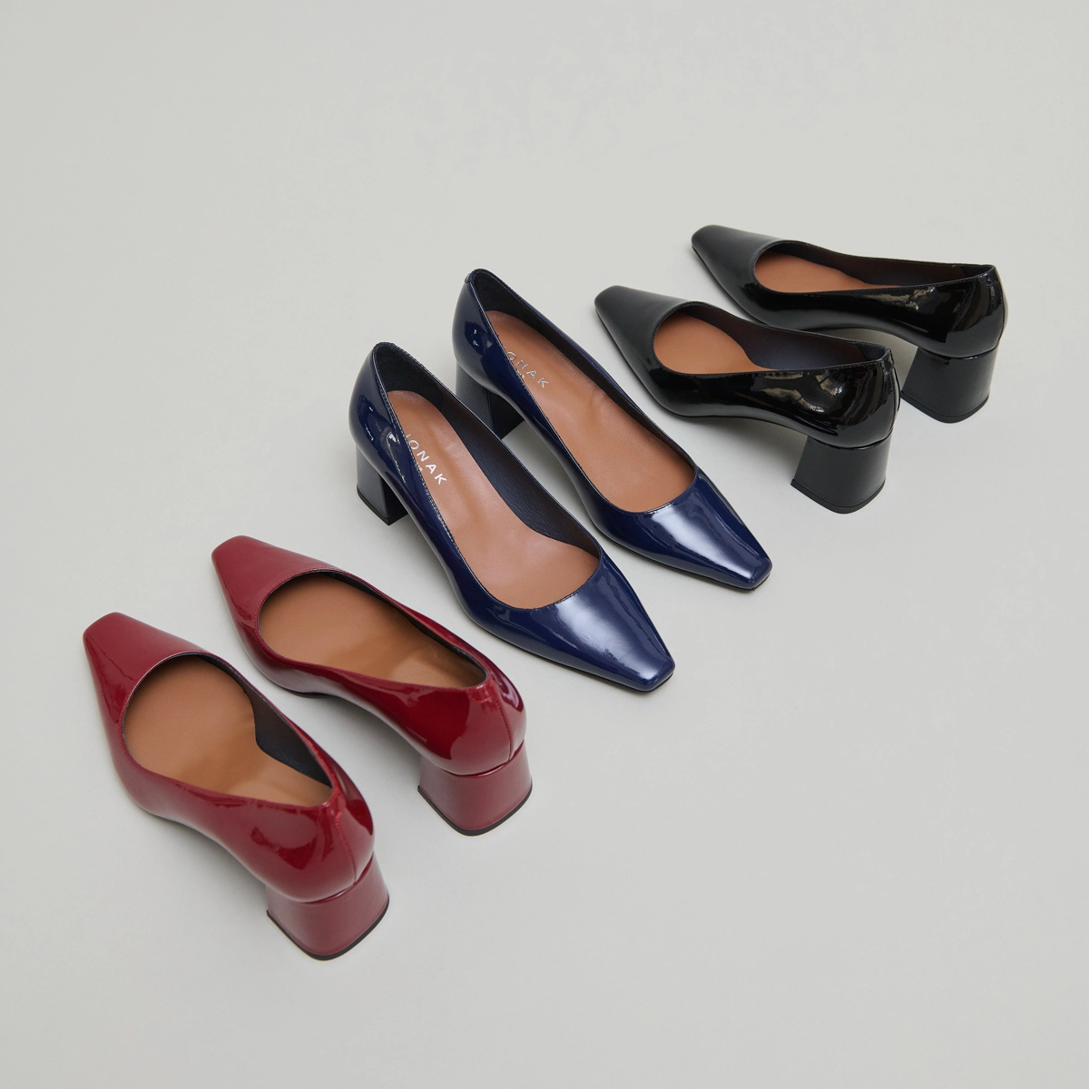 Escarpins à talons recouverts in carmine red patent | DULINA