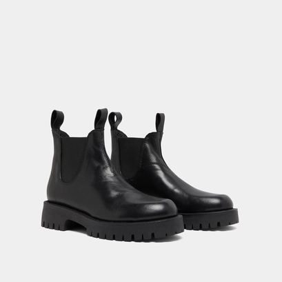 Boots &agrave; semelles crant&eacute;es in black leather | roche