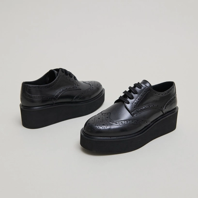 Derbies compens&eacute;es in black leather | adrielle