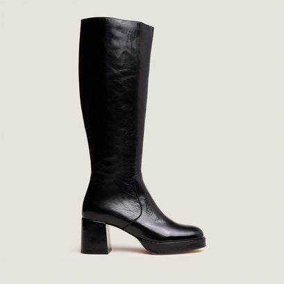 Heeled platform boots in black distressed leather | vaneo