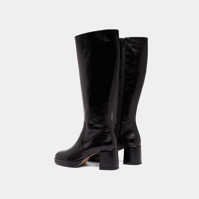 Heeled platform boots in black distressed leather | vaneo