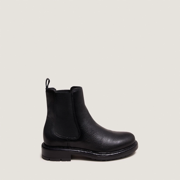 Lowboots with elastic straps and notched soles in black grained leather | CELINA
